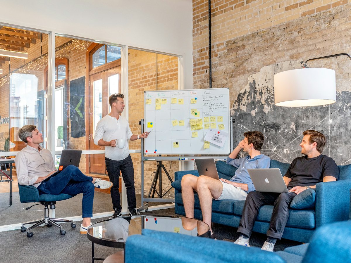 The AI Boardroom at Industrious East 7th, where Austin and Darby taught the company brain session live